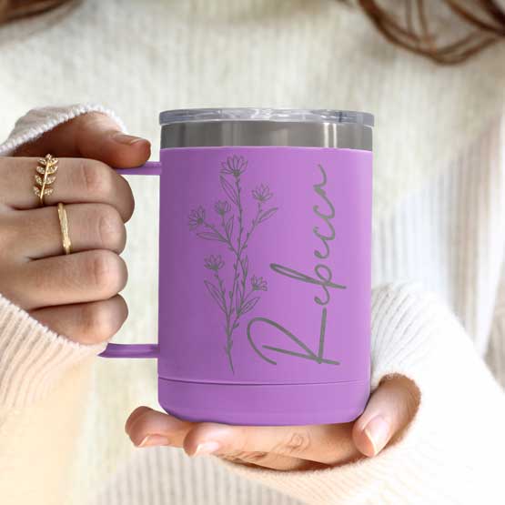 Woman Hands Holding Light Purple Stainless Steel Coffee Tumbler Mug With Handle And Engraved With Name And Flower Art
