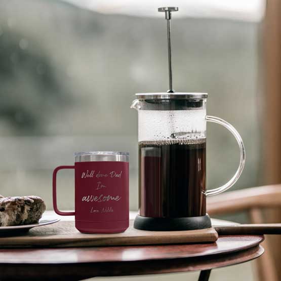 Maroon 15 Ounce Tumbler Mug Engraved With Well Done Dad I’m Awesome Message And Name On Dining Table With Coffee Press