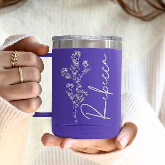 Woman Hands Holding Purple Stainless Steel Coffee Tumbler Mug With Handle And Engraved With Name And Flower Art