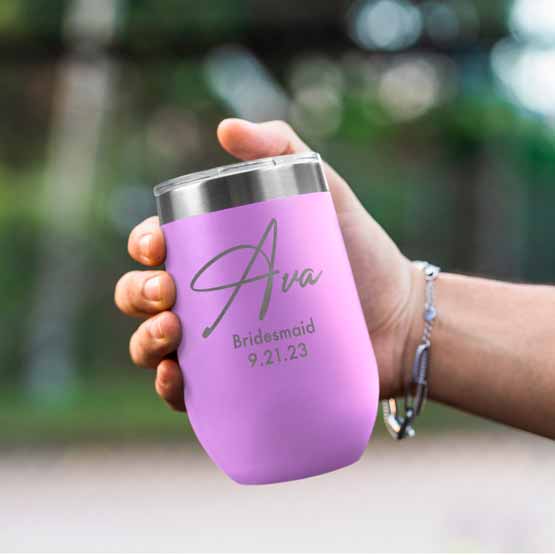 Woman Hand Outdoors Holding Custom Light Purple Stemless Wine Tumbler Engraved With Name And Date And Bridesmaid Text