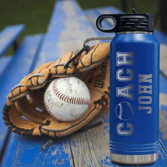 Blue 32 Ounce Water Bottle Laser Engraved With Name And Baseball Inside Coach Text On Picnic Table Beside Baseball Glove