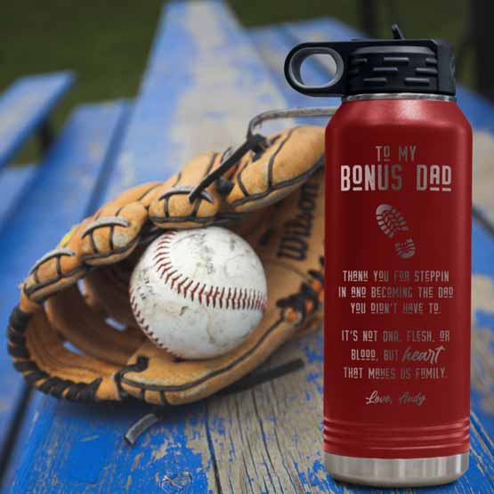 32 Ounce Red Water Bottle Engraved With To My Bonus Dad Father’s Day Message And Name On Picnic Table With Baseball Glove