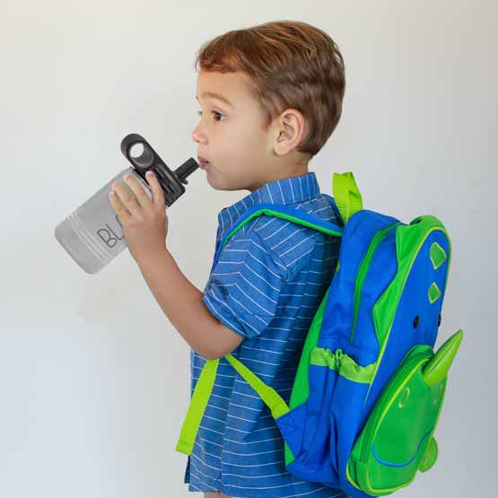 Little Boy With Backpack And Drinking From White Stainless Steel Child Water Bottle With Straw And Engraved Name