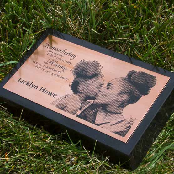 Custom Engraved Copper Headstone On Granite Stone Set On Grass.