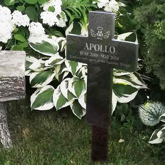 Cross Shaped Granite Headstone Engraved With Dog Memorial Message And Years Lived And Paw Print Standing In Garden Via Spike