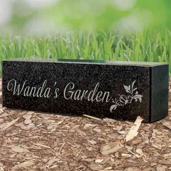 Rectangle Granite Pillar With Landscape Layout And Engraved With Flower Art And Wanda’s Garden Text In Garden Mulch