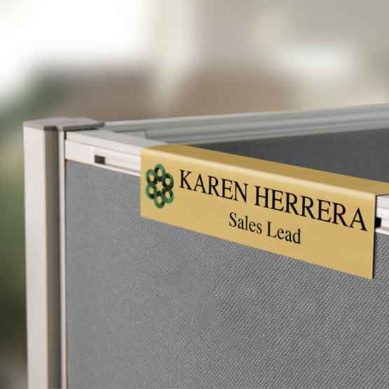 Custom Printed Gold Aluminum Cubicle Name Plate On Top Of Gray Cubicle.