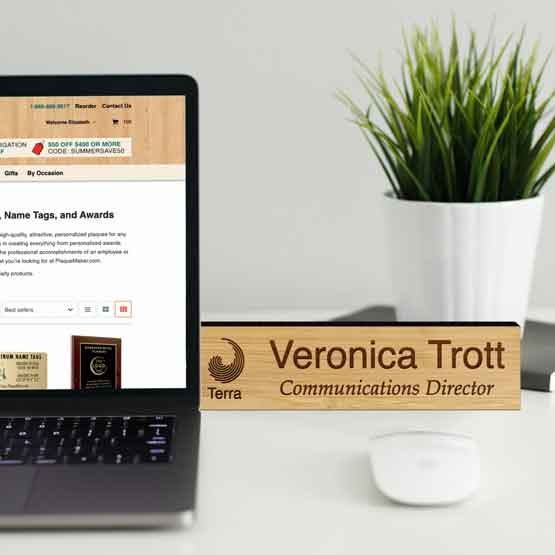 Custom Engraved Bamboo Desk Plate Near Laptop And Plant.