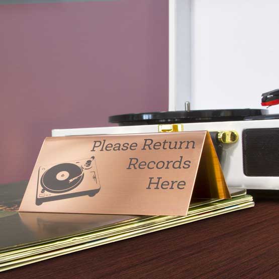 Custom Engraved Copper Table Tent Name Plate Near Record Player and Records on Table.