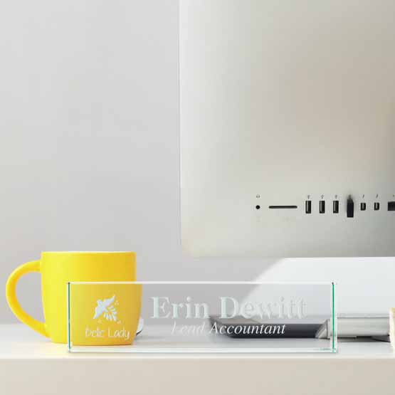 Custom Glass Desk Name Plate Engraved With Company Logo And Accountant Details On Office Desk With Computer And Yellow Mug