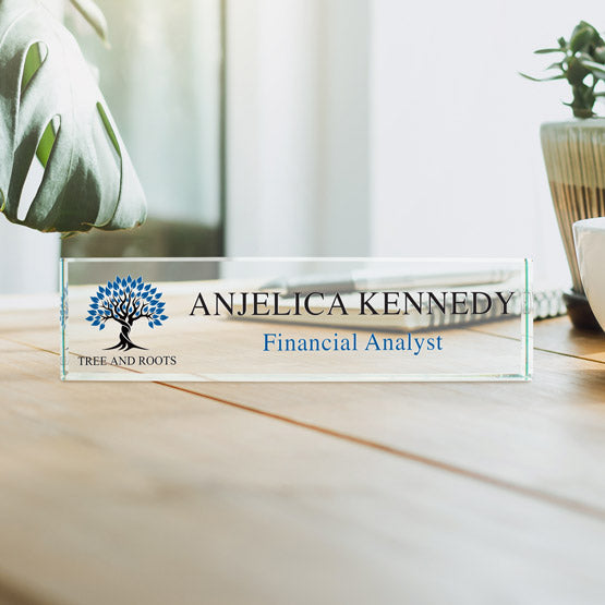 Custom Glass Desk Name Plate Engraved With Company Logo And Financial Analyst Details On Wood Table With Plants