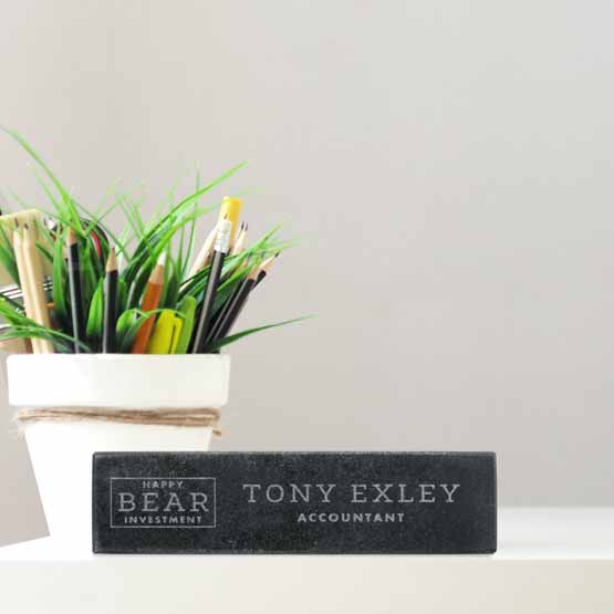 Custom Granite Desk Name Plate Engraved With Company Logo And Accountant Details On Office Desk With Small Potted Plant