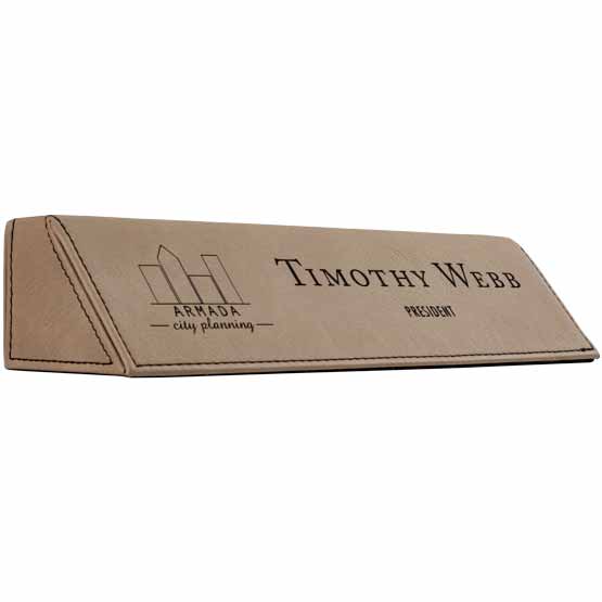 Light Brown Faux Leather Desk Wedge Laser Engraved With Sample Logo And Employee Name And Role Against White Background