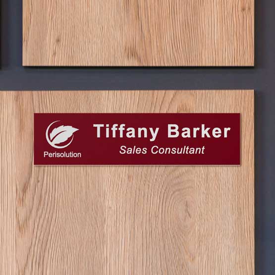 Custom Engraved Plastic Office Door Name Plate With Logo On Wall Near Closed Door.