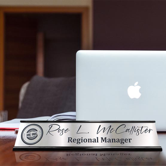 Custom Stainless Steel Desk Name Plate Near Laptop And Book On Desk.