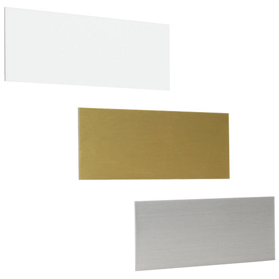 Trio Of Blank Aluminum Tags In White And Gold And Silver With Rectangle Shape Against A White Background