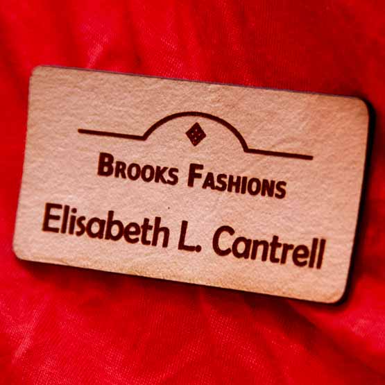 Engraved Custom Leather Name Tag For Merchant On Red Shirt.