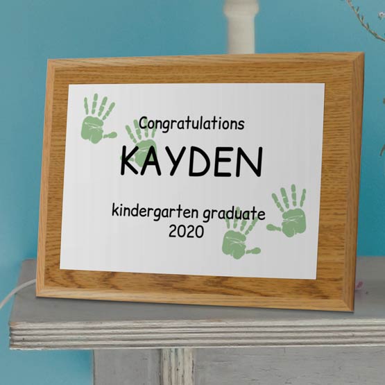 Custom Printed Kindergarten Graduation Plaque With Handprints On Side Table.