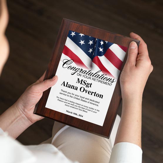 Custom Military Retirement Plaque Held By Woman While Sitting.