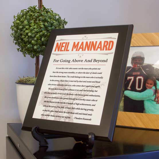 Custom Man In The Arena Plaque With Your Name On Easel Near Topiary Potted Plant.