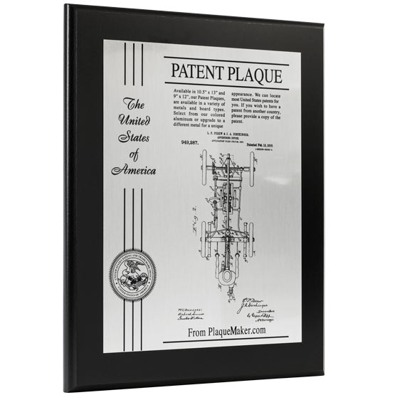 Custom Silver Aluminum Patent Plaque With Patent Details And Seal And Ribbon On A Black Board With Same Day Shipping