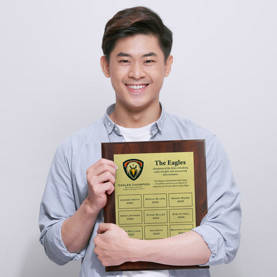 Man Holding Custom Economy Perpetual Plaque With Wood Board And Gold Plates With Employee Names And Company Details