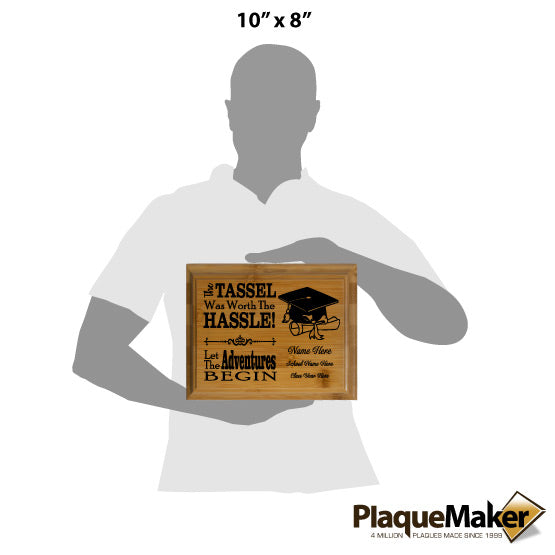 Size Guide With Blank Figure Holding Solid Bamboo Plaque Laser Engraved With Graduation Hat Artwork And Fun Tassel Message