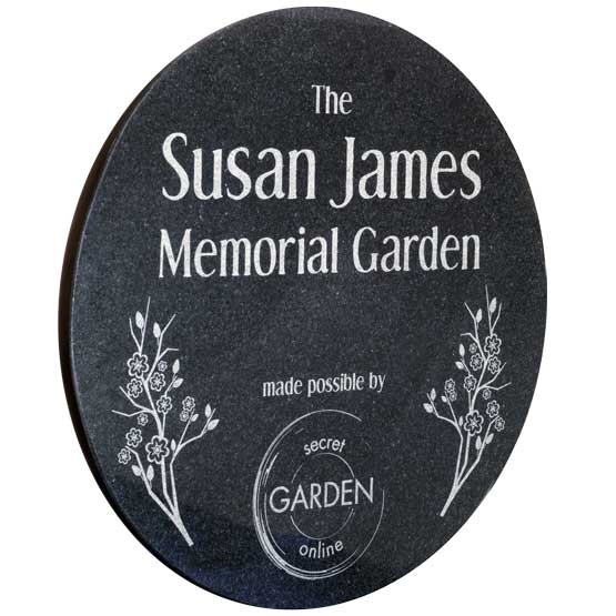 Granite Circle Plaque Laser Engraved With Susan James Memorial Garden Message And Flower Art Against White Background