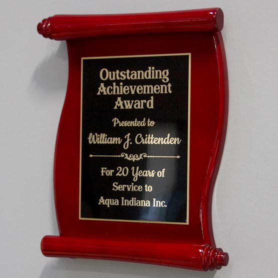 Custom Rosewood Scroll Shaped Plaque Award For Outstanding Achievement With Black Metal Plate Mounted On Office Wall