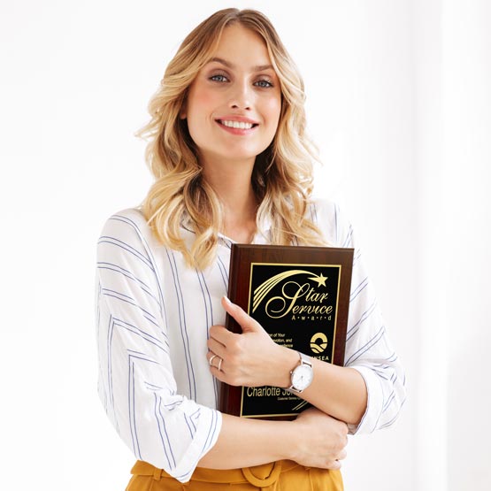Happy Businesswoman Holding A Custom Metal Plaque With Wood Board And Laser Engraved With Star Service Award Message