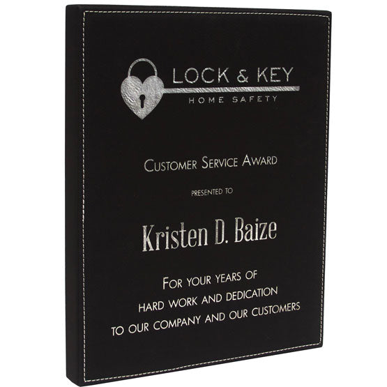 Black Faux Leather Plaque Award For Customer Service With Logo And Employee Name And Message Against A White Background