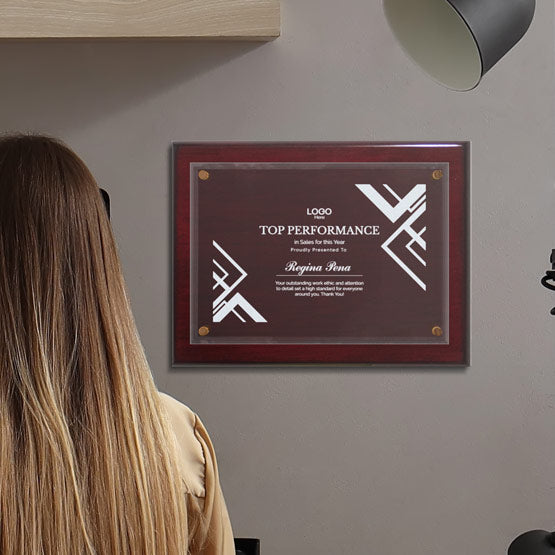 Custom Floating Glass Plaque On Rosewood Board With Logo For Regina Pena On Wall.