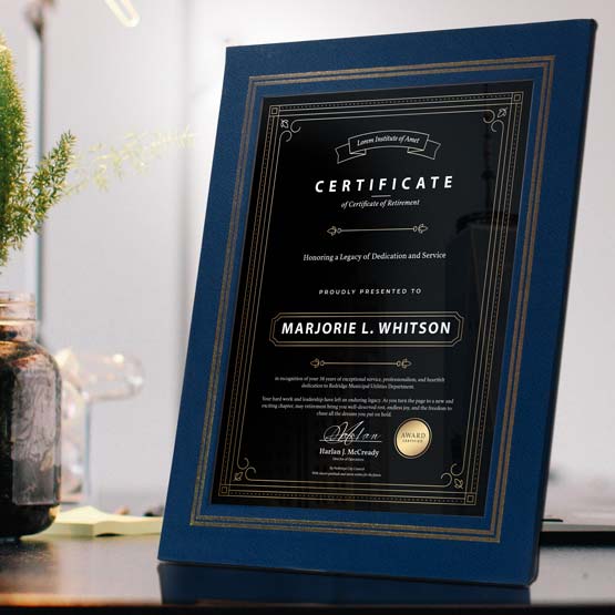 Blue Vinyl Certificate Folder Plaque On Desk Near Plant And Sticky Notes.