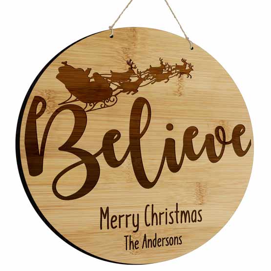 Circle Bamboo Sign Laser Engraved With Santa In Sleigh Art And Merry Christmas And Believe And Family Name Hanging Via Twine
