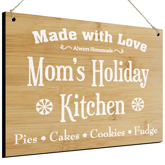 Full Color Bamboo Sign Printed With Mom’s Holiday Kitchen And Made With Love And Desserts Text In White Hanging Via Twine