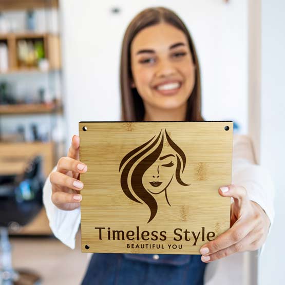 Happy Woman Holding Custom Rectangle Bamboo Sign Laser Engraved With Beauty Store Logo And Name And Slogan And Holes