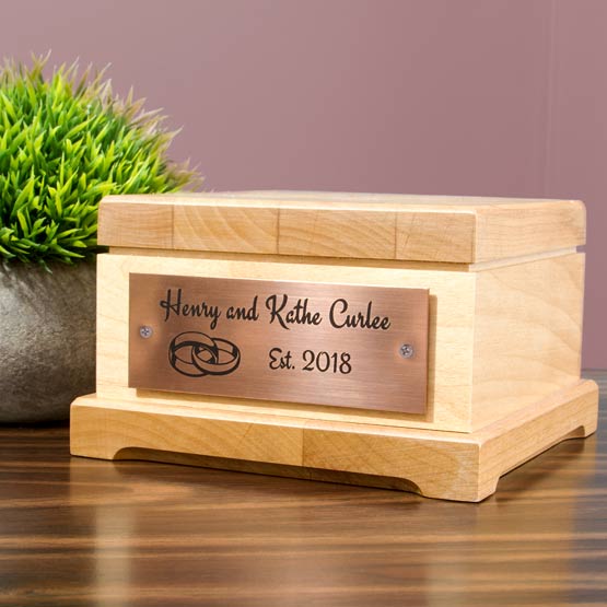 Copper Label Laser Fused With Couple Names And Date And Wedding Ring Art Mounted To Wood Jewelry Box On Shelf With Plant