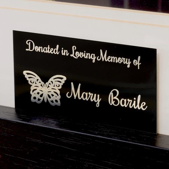 Black And Silver Aluminum Label Laser Engraved With Butterfly Art And Donation Memorial Message Mounted On Wood Panel