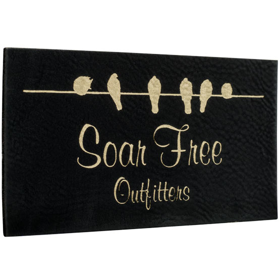 Custom Black And Gold Faux Leather Label Laser Engraved With Perched Birds Artwork And Soar Free Outfitters Logo 