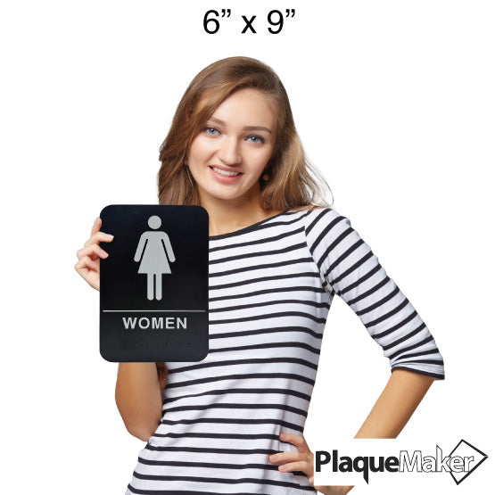 Size Guide Of Woman Holding Custom Black And White Plastic Sign With Women Icon And Corresponding Text And Braille