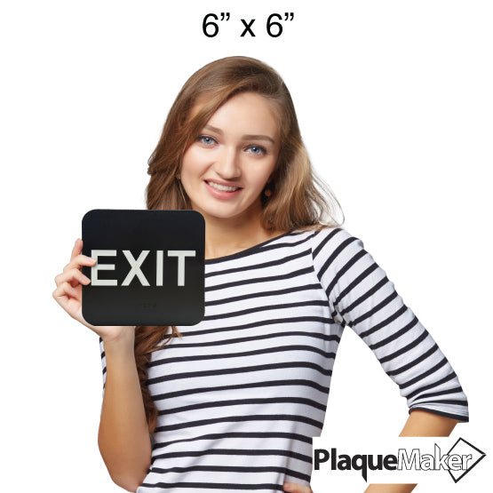 Size Guide Of Woman Holding 6 By 6 Black And White Plastic Sign With Large Exit Text And Corresponding Braille